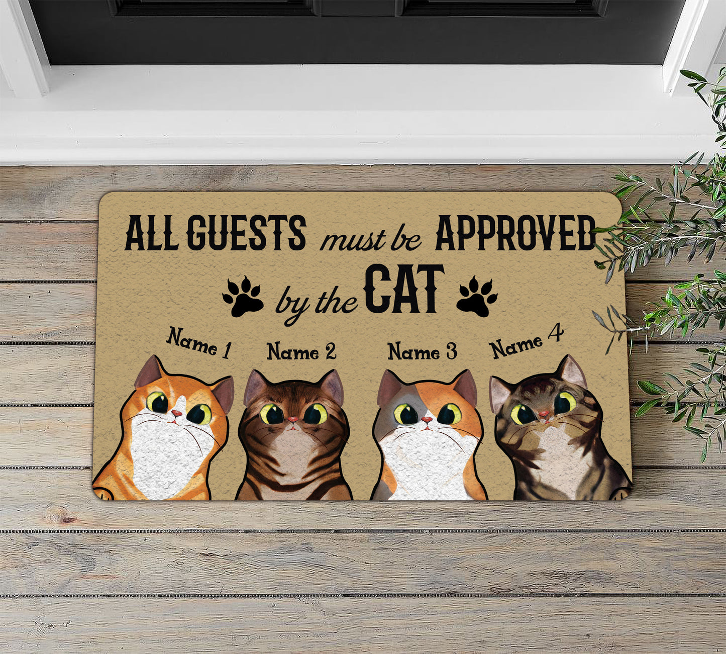 Doormat with cat-themed design and text on a wooden floor.